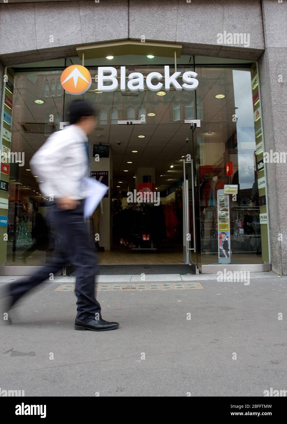 A person passes in front of a branch of Blacks Leisure Group, London. 28/05/09 Stock Photo
