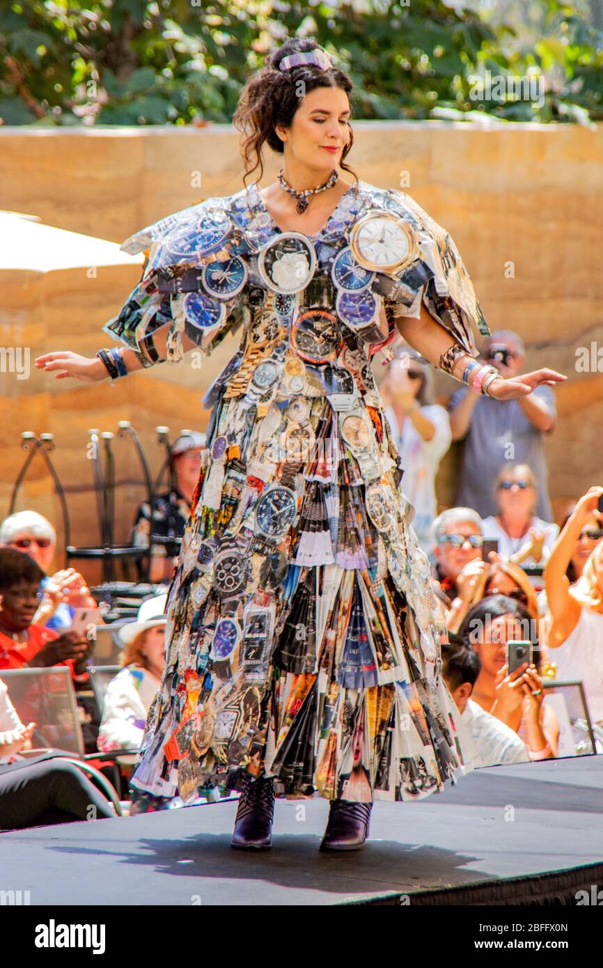 At a show of fashions made from found objects in Laguna Beach, CA, a woman models an eclectic outfit composed of magazines, tape, thread and staples intended to evoke H.G. Wells' sci-fi novel 'The Time Machine' in 1895. She won Most Exciting Ensemble Inspired by The Time Machine Stock Photo