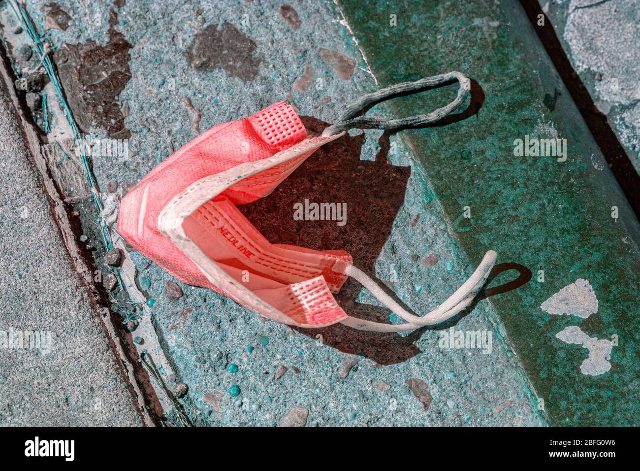 Discarded COVID-19 protective wear on the streets of Brooklyn, New York. Stock Photo