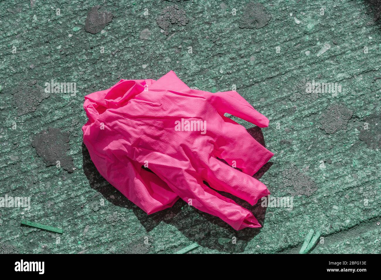 Discarded COVID-19 protective wear on the streets of Brooklyn, New York. Stock Photo