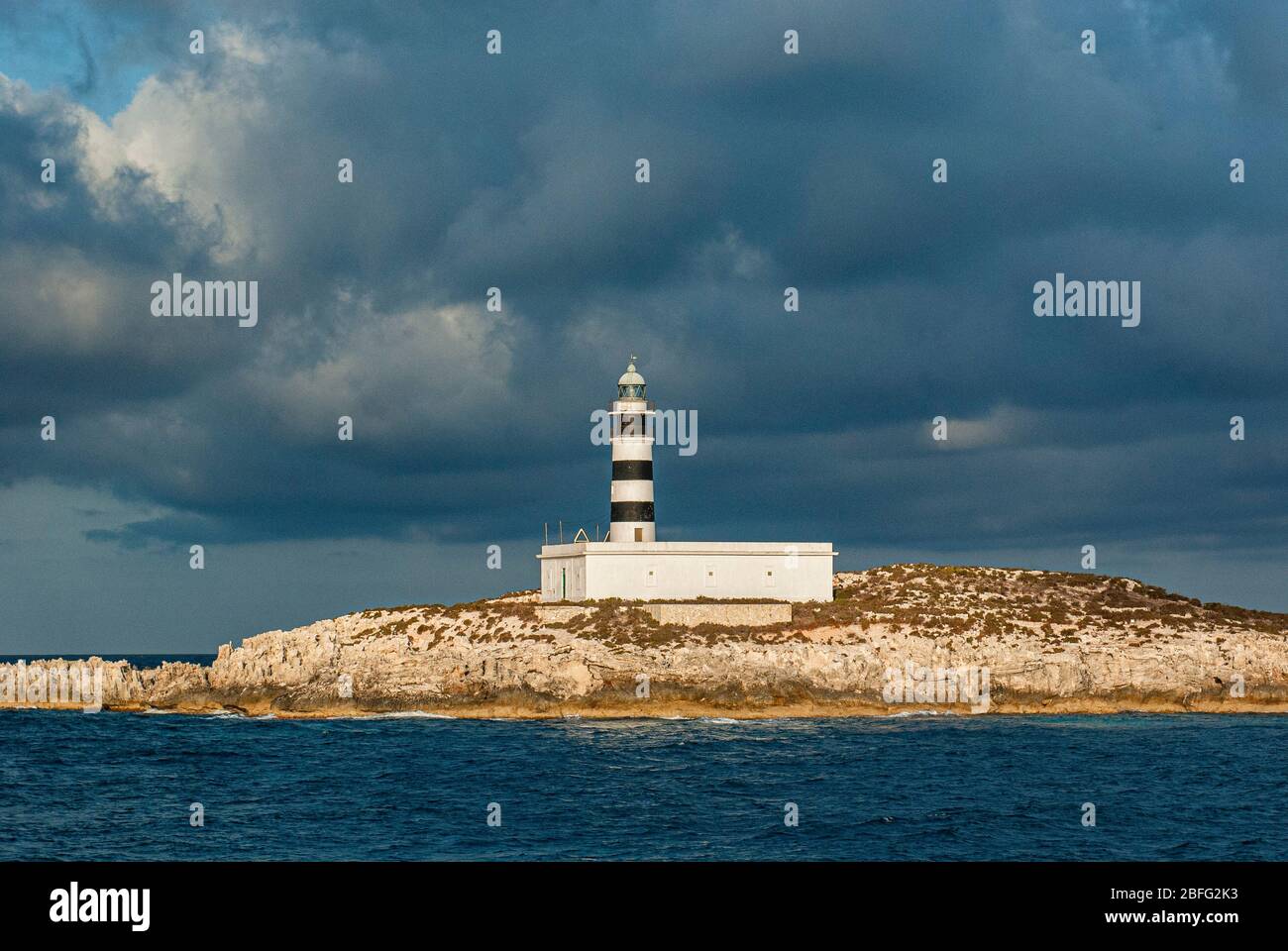 Faro des Penjats, Ibiza, Balearic Islands, Spain. It is located on the Isla de Penjats, very close to the port of Ibiza. Built in 1856. Stock Photo