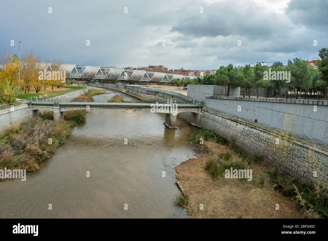 MADRID, SPAIN - DECEMBER 13, 2018: The Arganzuela bridge over Manzanares River downtown Madrid, Spain. It is a futuristic structure built in 2011. Sup Stock Photo