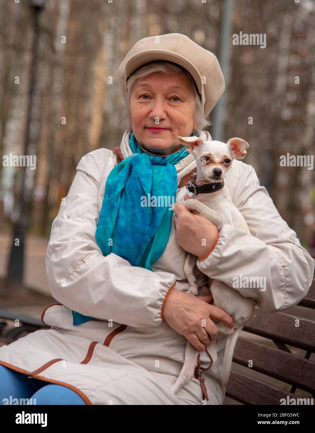 Woman park bench dog lap hi-res stock photography and images - Alamy