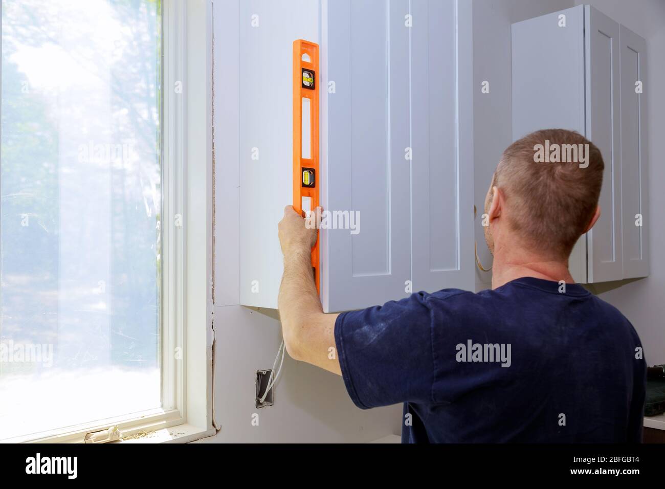 Kitchen furniture set installation hanging level a modern domestic with