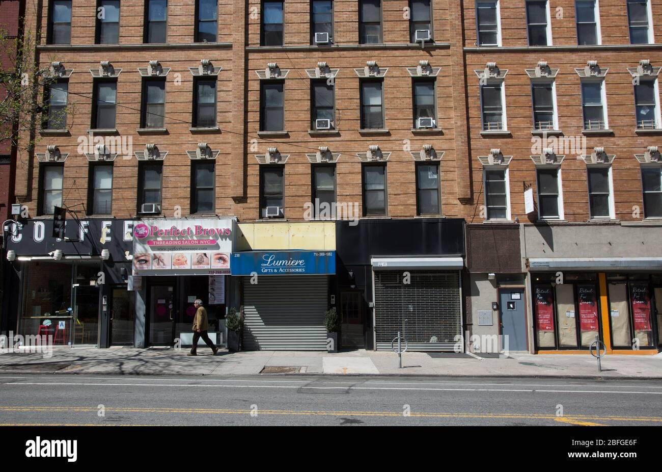 Boarded up storefronts on 7th Avenue in Park Slope, Brooklyn due to the Coronavirus pandemic. Stock Photo