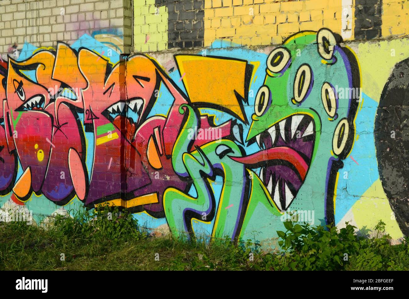 Abstract Colorful Fragment Of Graffiti Paintings On Old Brick Wall With Scary Octopus Face Street Art Composition With Parts Of Unwritten Letters And Stock Photo Alamy