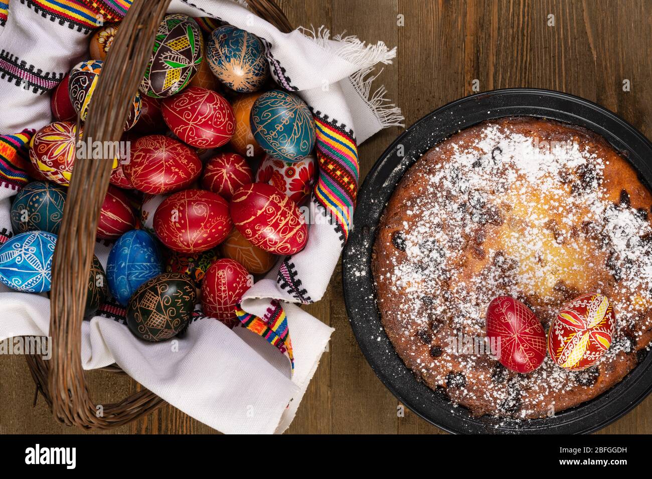 Traditional romanian cake called Pasca with hand painted easter eggs in