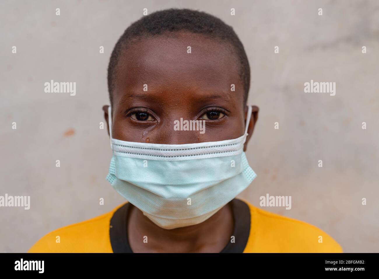 Chilren Wearing Facemask in Africa Pandemic outbreak of Conora virus AKA Covid19 Stock Photo