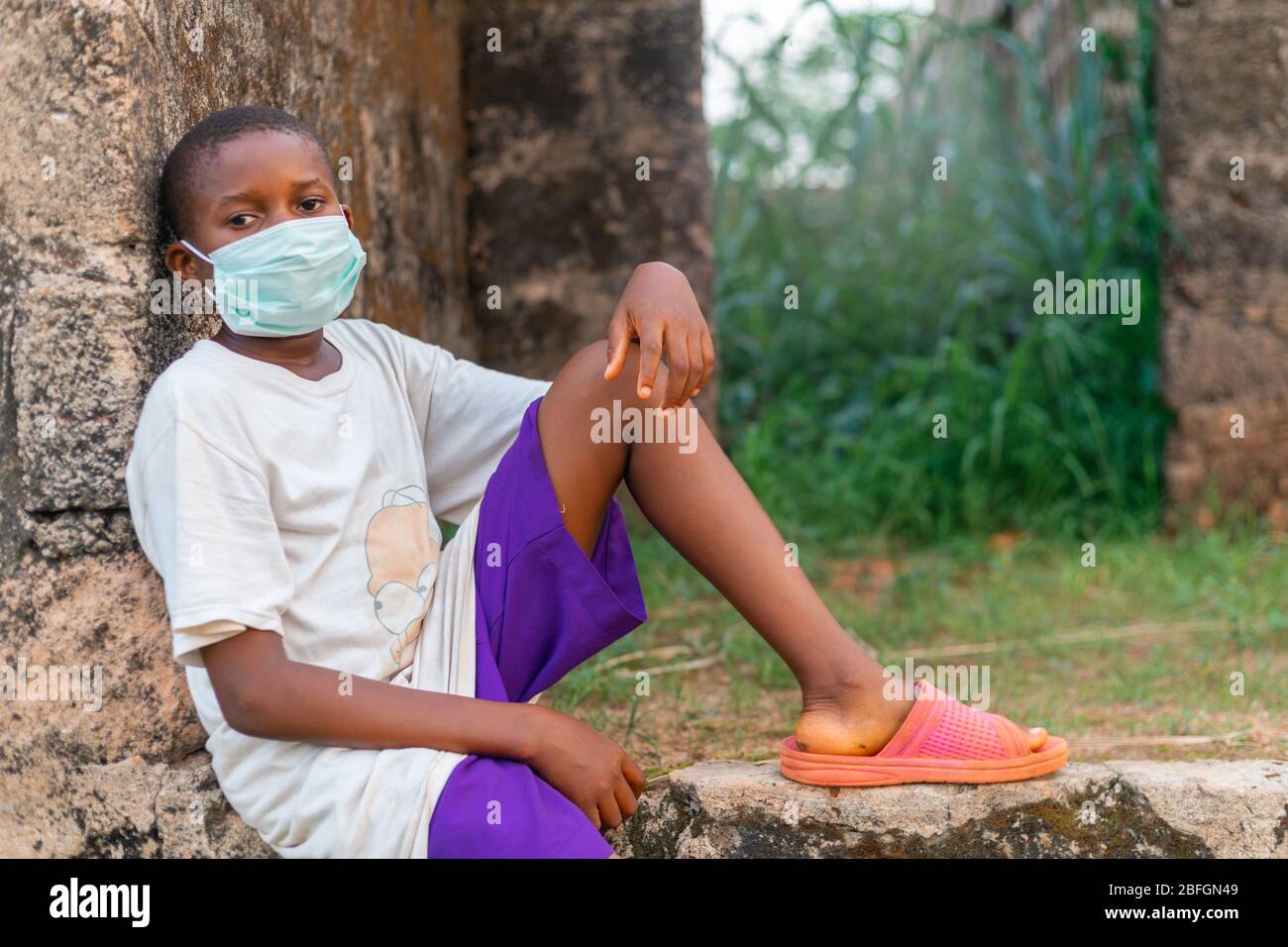 Chilren Wearing Facemask in Africa Pandemic outbreak of Conora virus AKA Covid19 Stock Photo