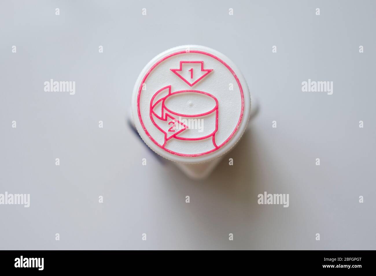 Lid of a medical pills, with openig instruction. Stock Photo