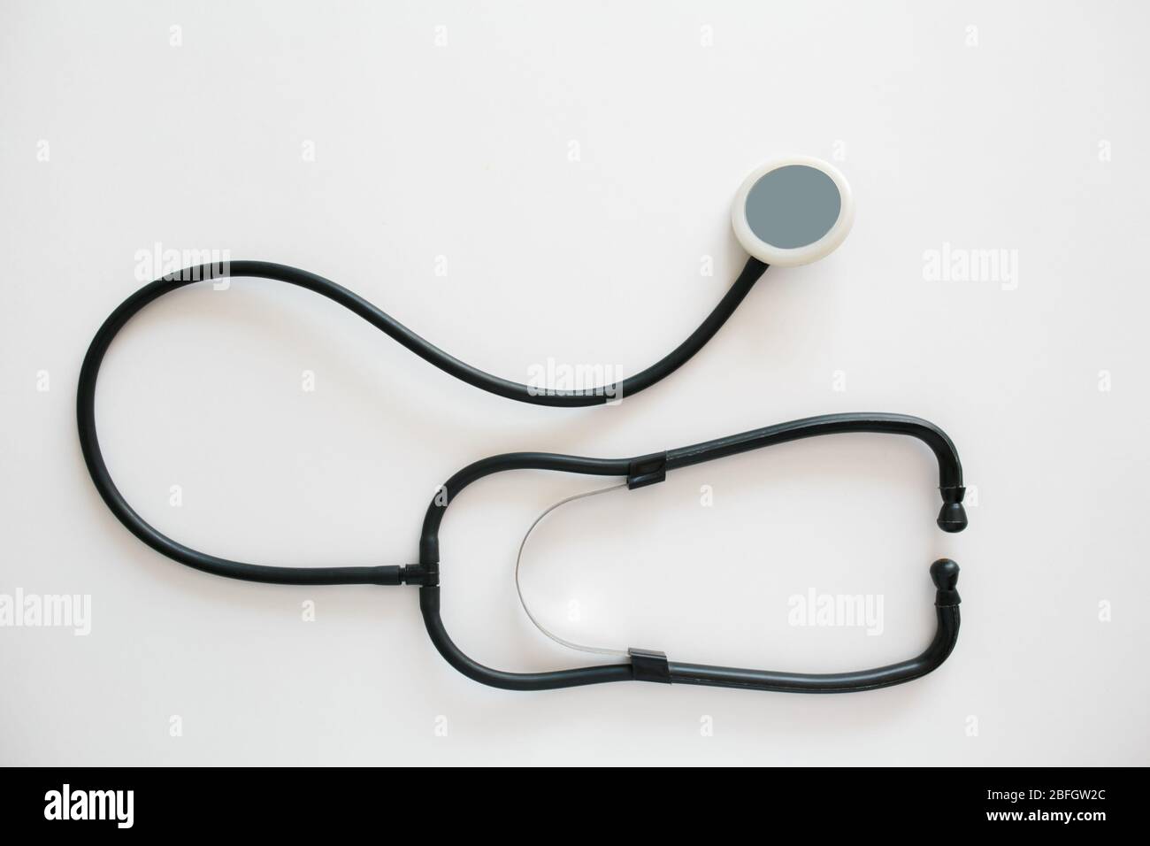 Black stethoscope isolated on white background. Healthcare Stock Photo ...