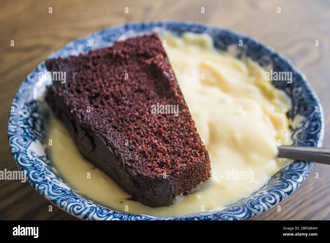 Chocolate Cake and Custard Stock Photo Alamy