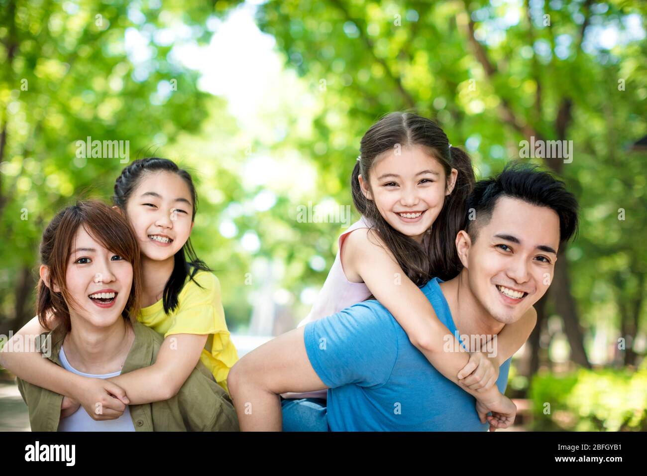 happy young family having fun outdoors Stock Photo