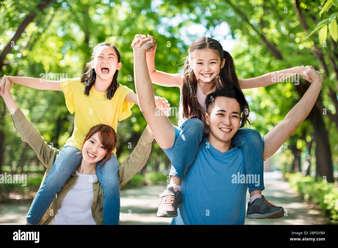 happy young family having fun outdoors Stock Photo