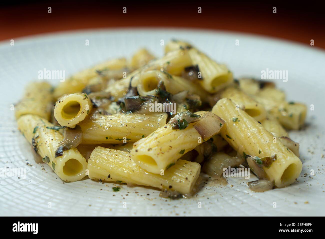 A dish of rigatoni with late red radicchio sauce Stock Photo