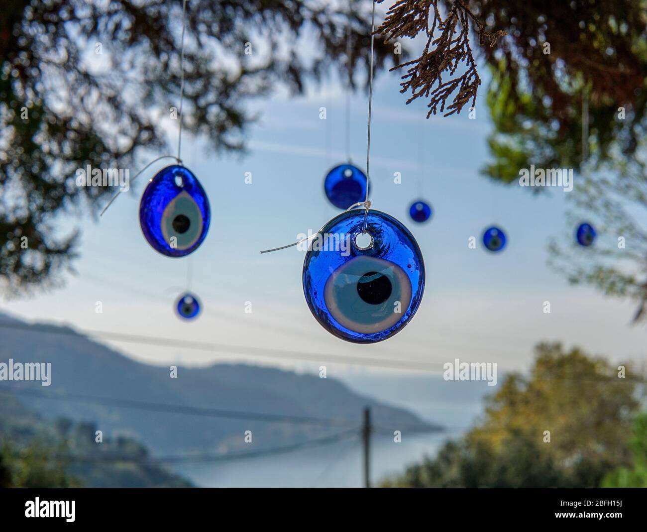 Evil eye, Nazar Boncugu, on tree close to anadolu kavagi at the Bosphorus Stock Photo
