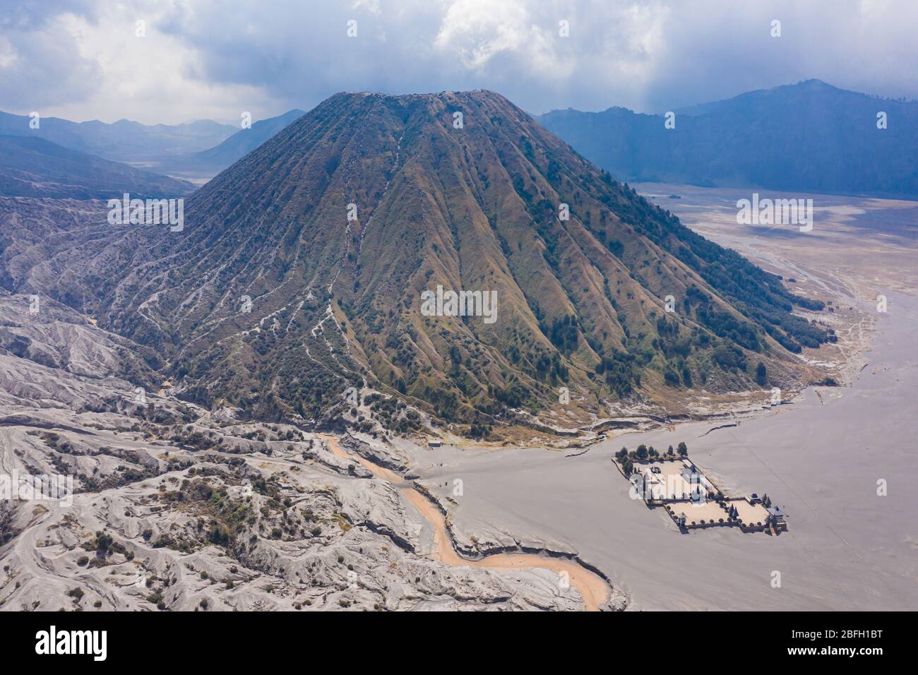 Aerial view of the volcanic cinder cone Mount Batok in the Mount Bromo national park, Java, Indonesia Stock Photo