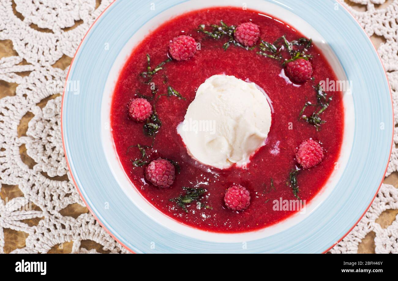 Raspberry sorbet in dish with scoop and served in sorbet glasses on doilies  Stock Photo - Alamy