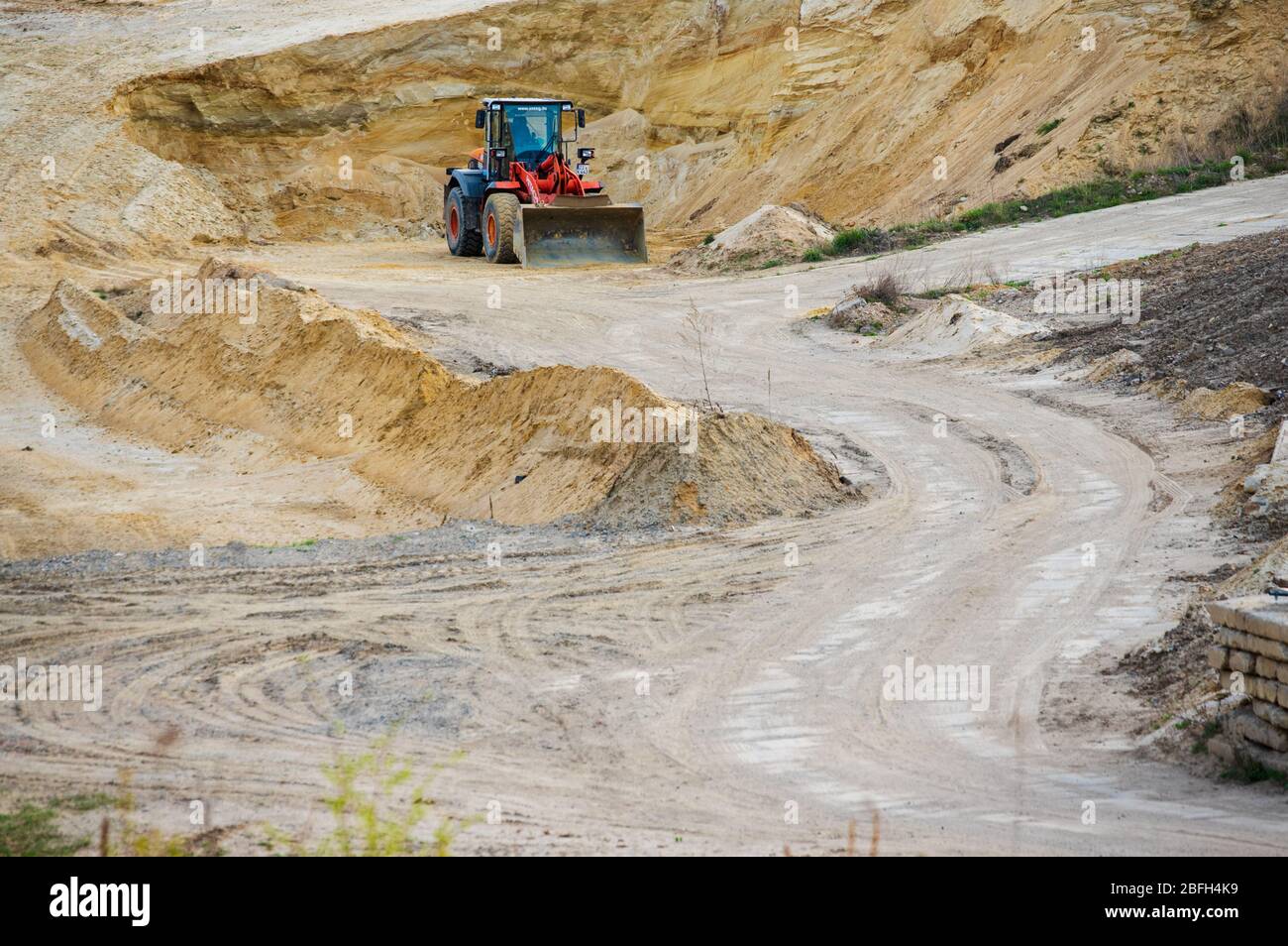 Hitachi wheel loader in sand pit of German OSTEG construction company Stock Photo