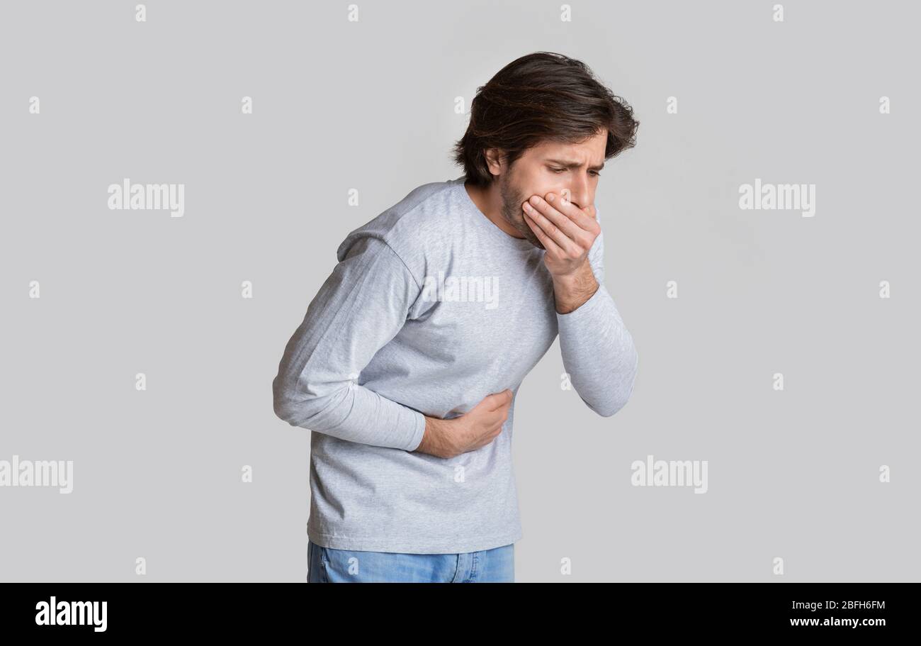 Nausea and stomach pain concept, free space Stock Photo Alamy