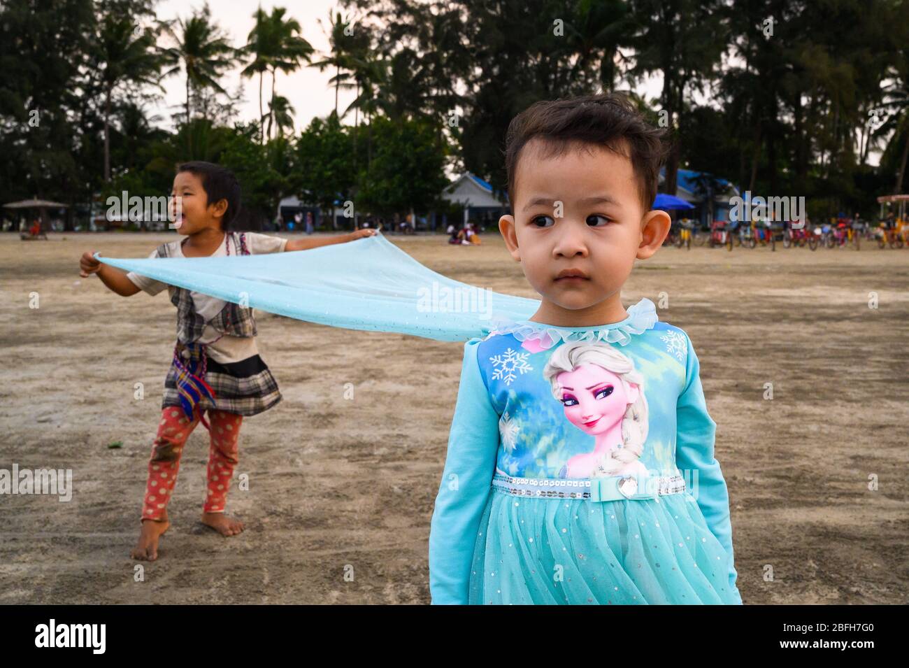 Young girls on the beach, Chaung Tha, Myanmar Stock Photo