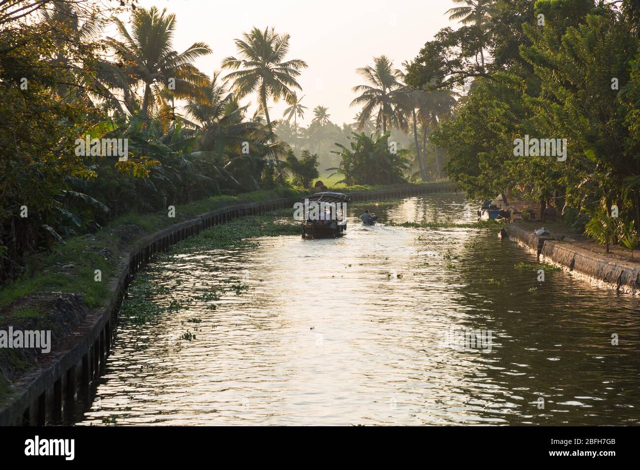Alleppey, Kerala - January 6, 2019: boats in a canal in alleppey backwaters kerala india Stock Photo
