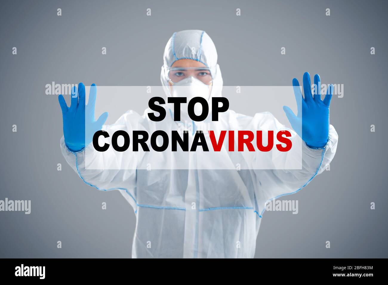 Population protection concept. Man holding inscription stop coronavirus Stock Photo