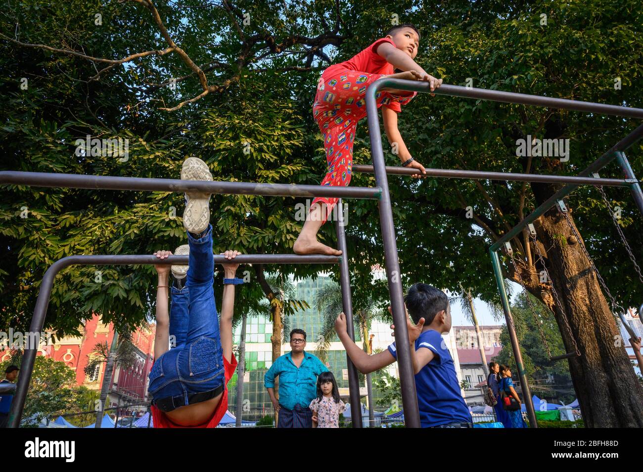 Kids playing in Mahabandoola Garden, Yangon, Myanmar Stock Photo