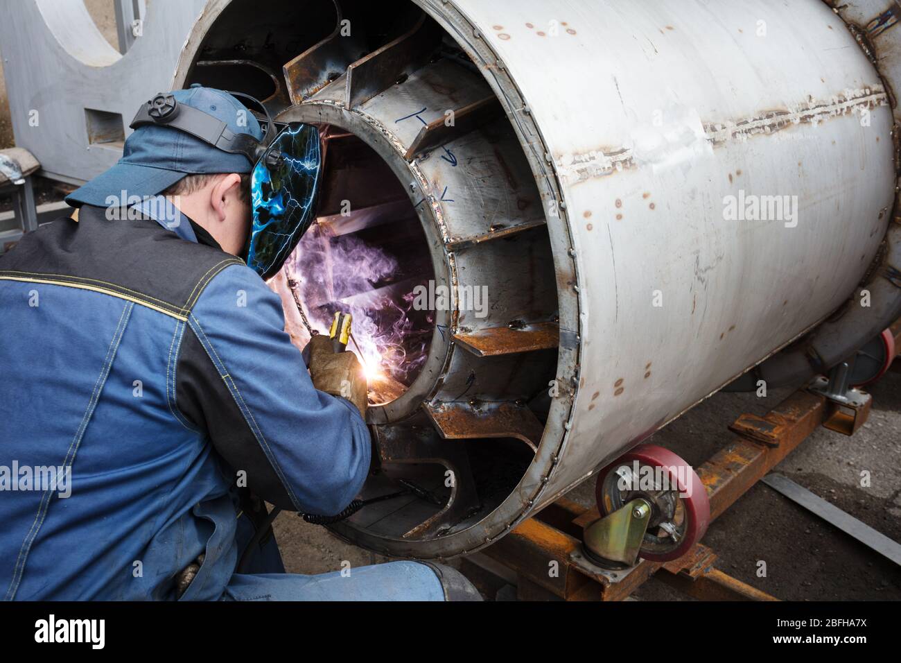 welders working at the factory made metal Stock Photo