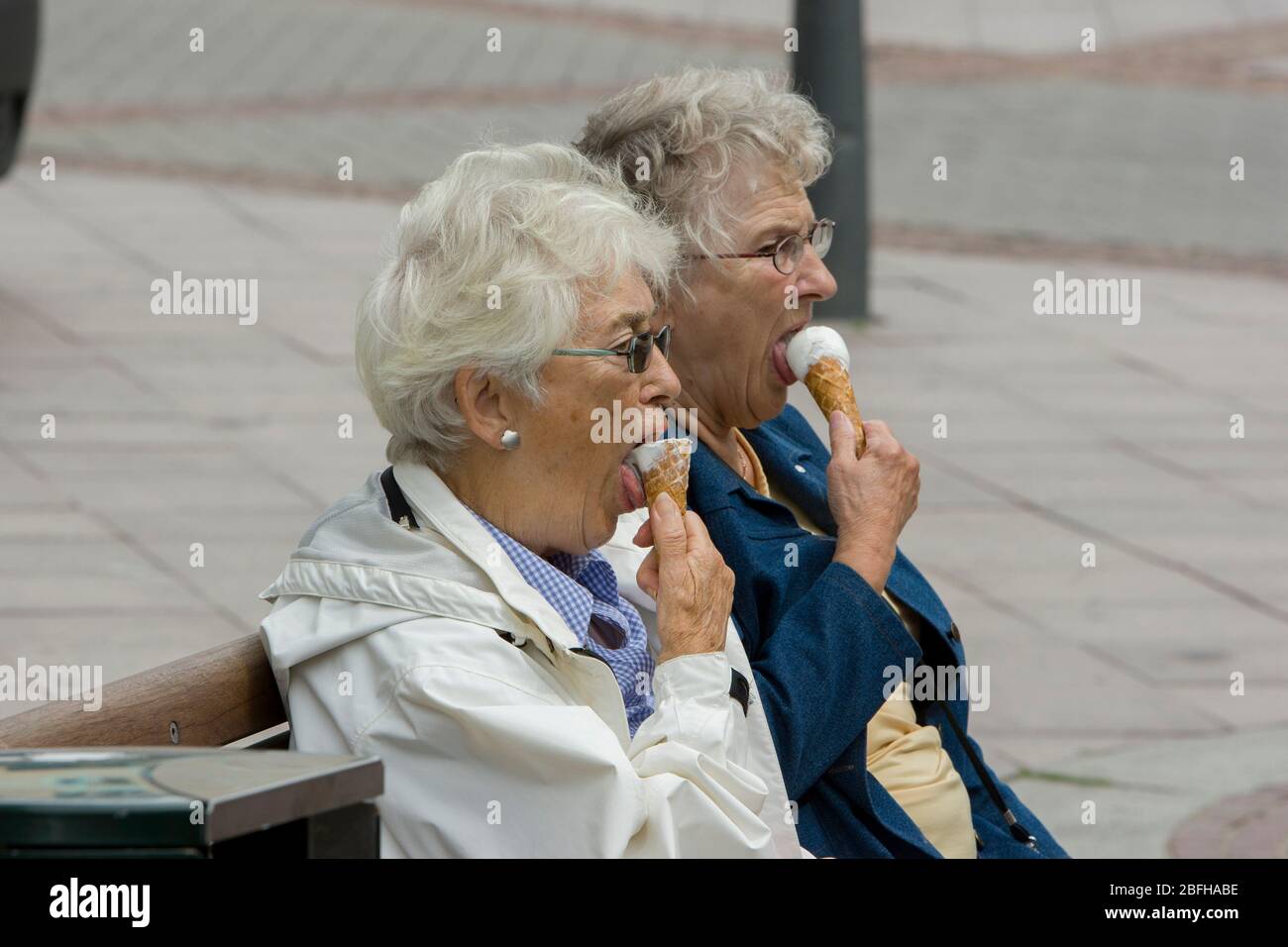 Two elderly women eat ice cream Stock Photo Alamy