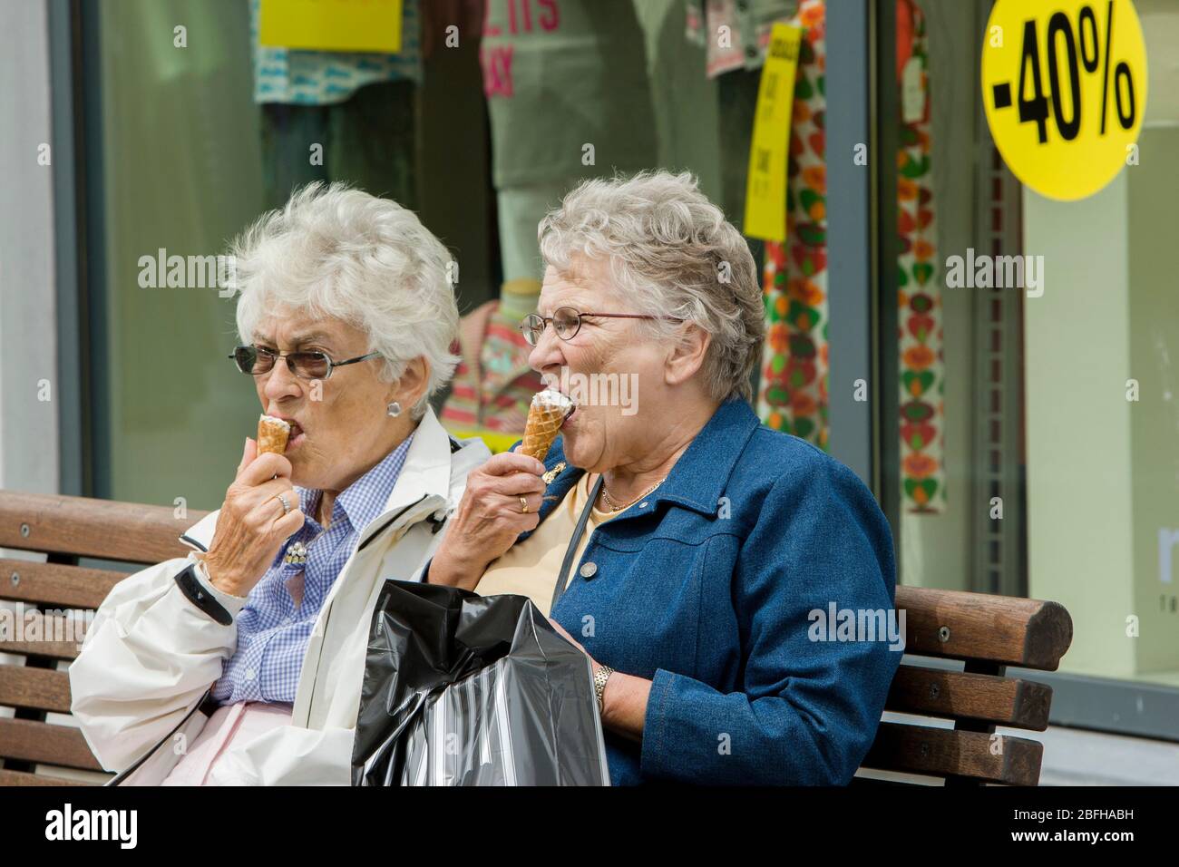 Two elderly women eat ice cream Stock Photo Alamy
