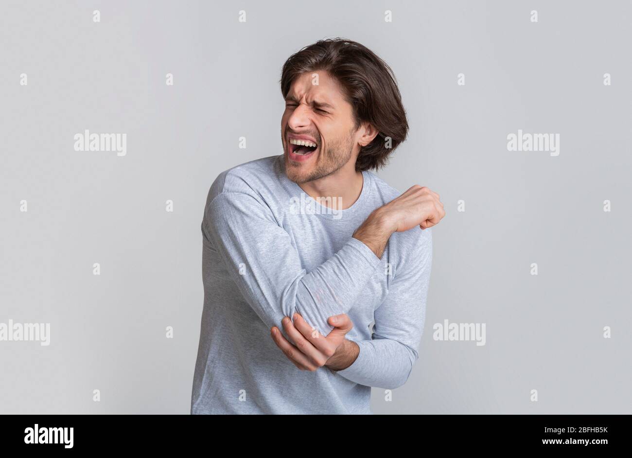 Inflamed chronic arthritis, man hurt isolated on gray background Stock Photo Alamy