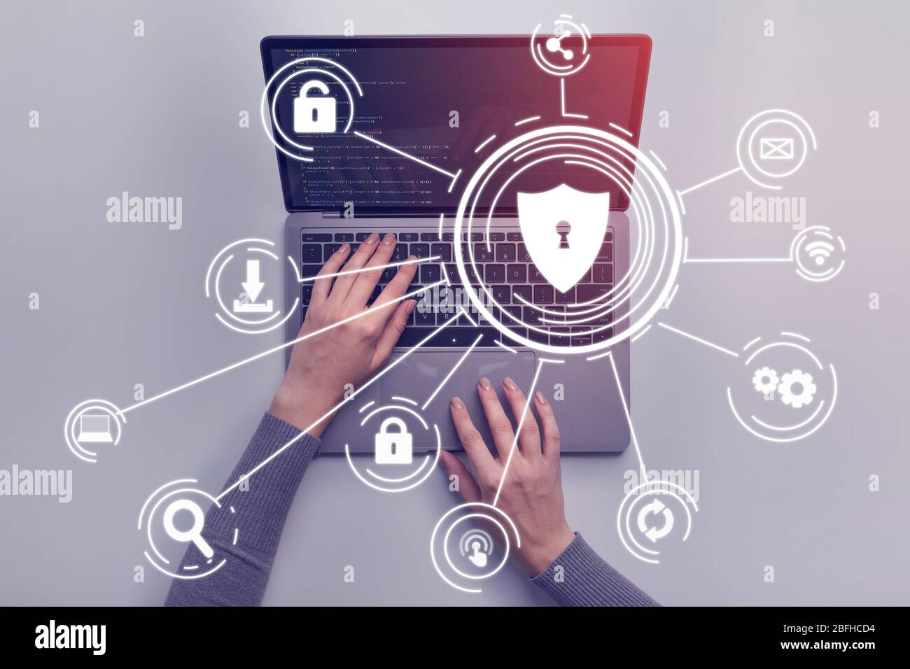 Hacker attack concept. Woman hands on laptop Stock Photo