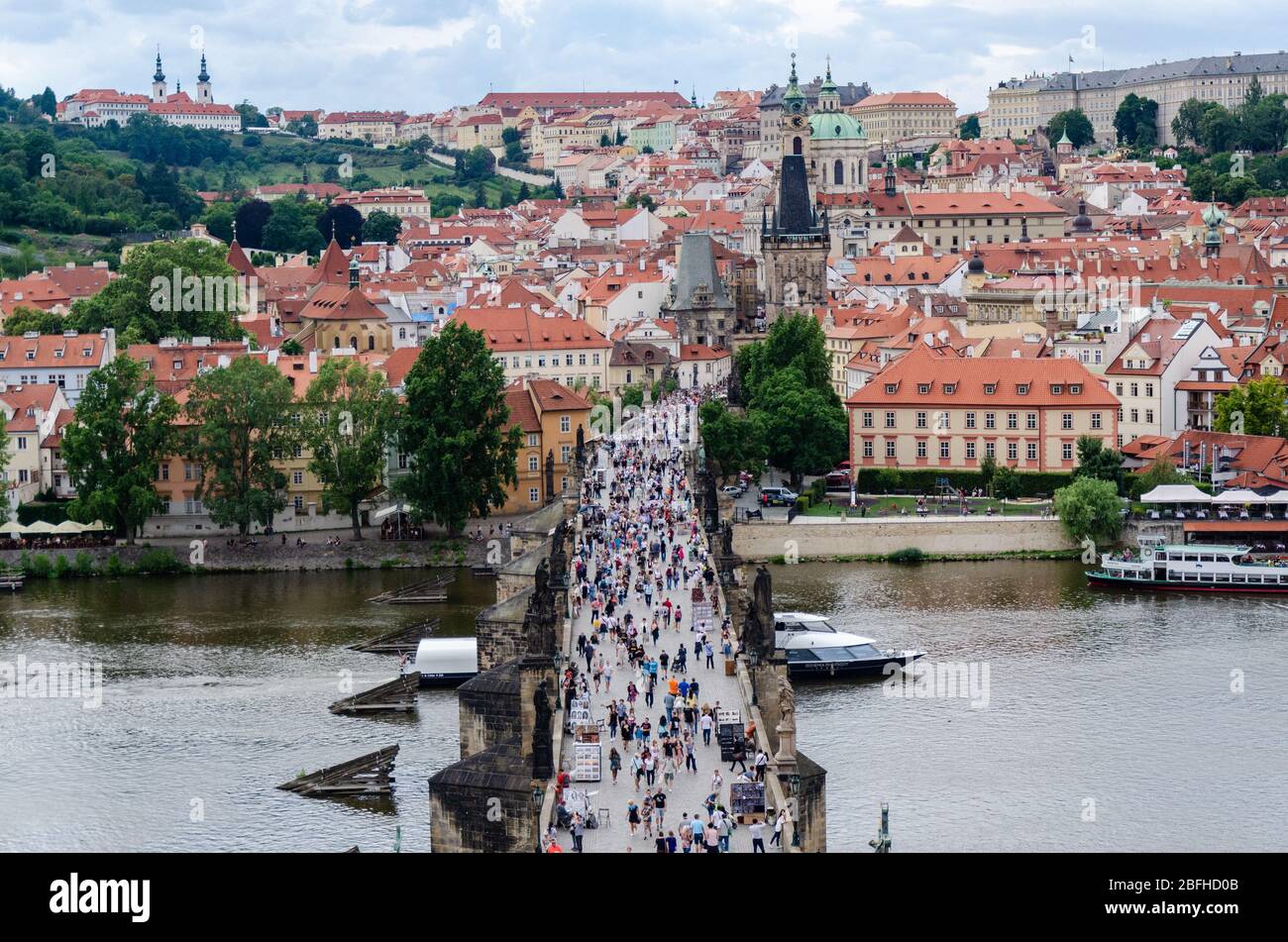 Tourists flocking the Charles Bridge and Malá Strana seen on the opposite side of the bridge from Old Town Bridge Tower, Prague, Czech Republic Stock Photo