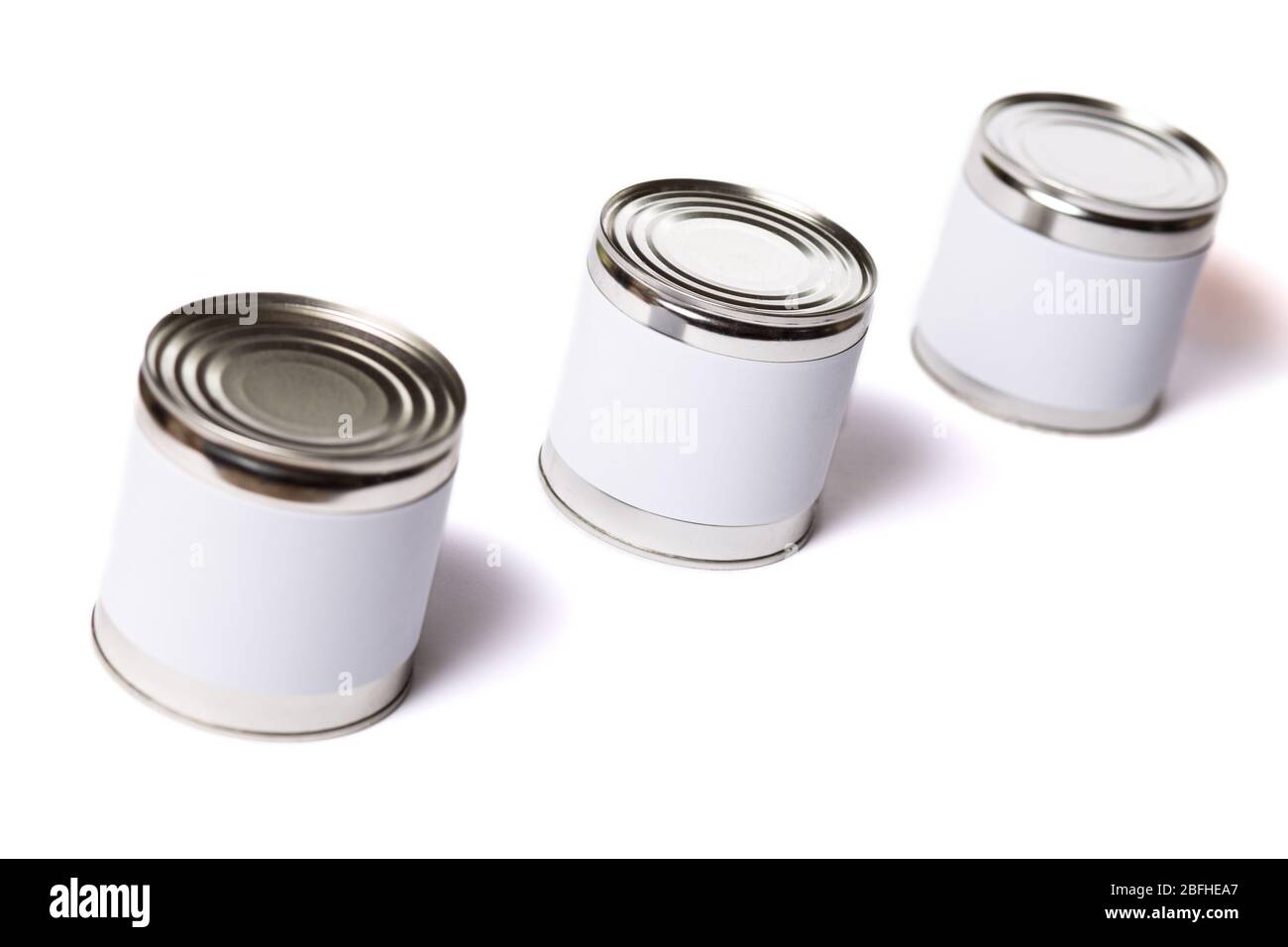 Preservations in meetal cans with no lables isolated on a white. Stock Photo