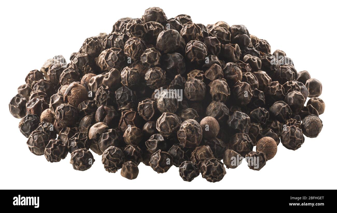 Pile of black peppercorns, a dried fermented seeds of Piper nigrum, isolated Stock Photo