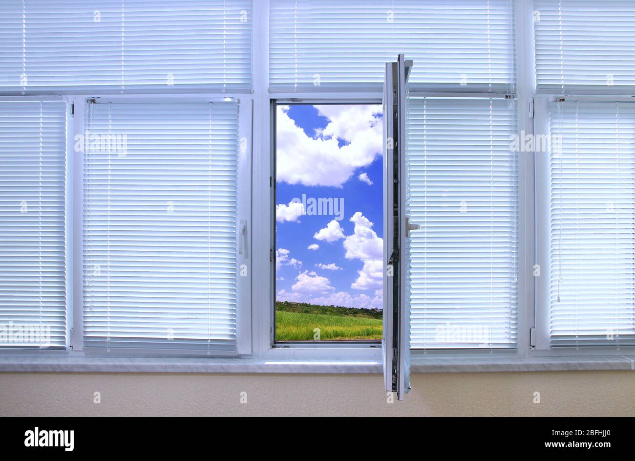 Sky view through an open window in room Stock Photo - Alamy