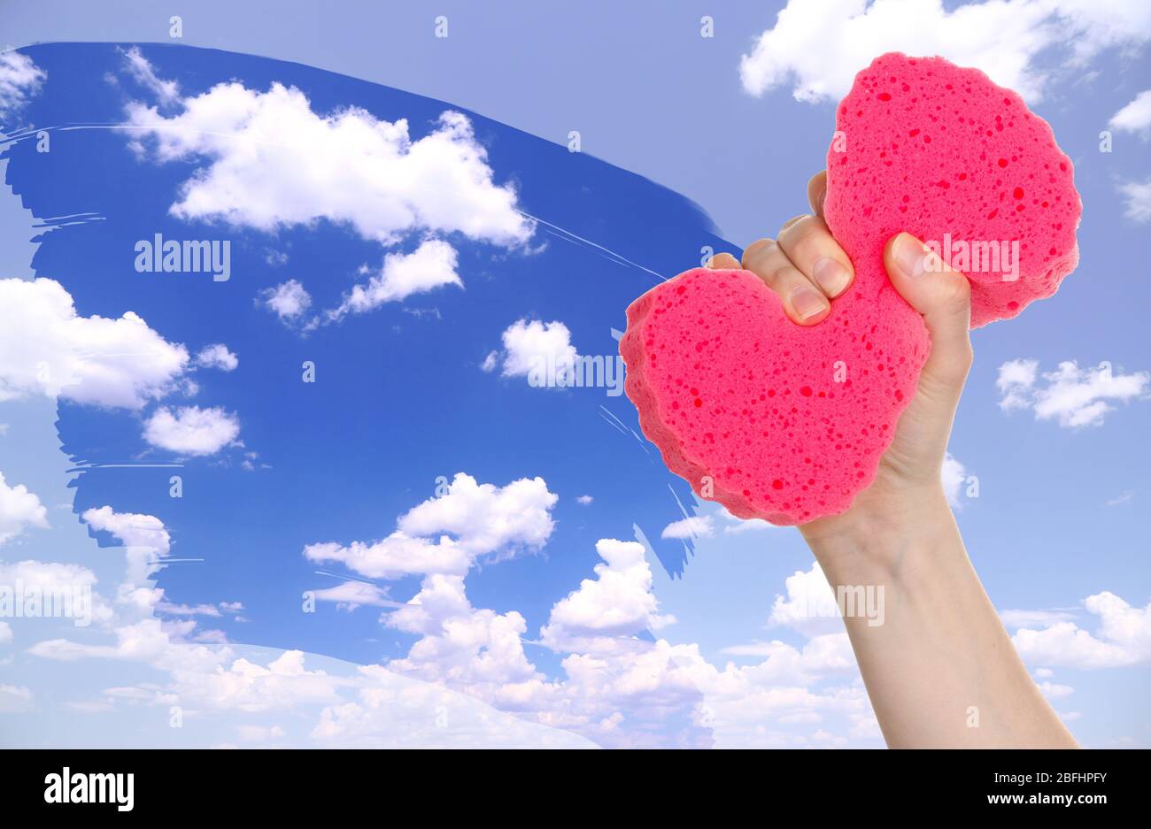 Hand with sponge cleaning dirty window Stock Photo Alamy