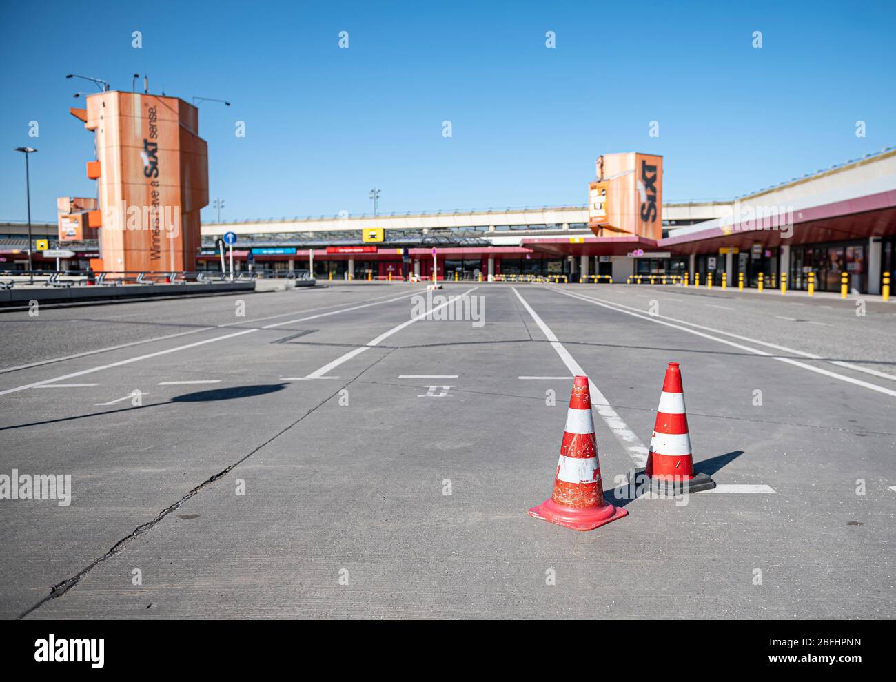 Berlin, Germany. 19th Apr, 2020. Two traffic pylons stand on the empty street in front of the entrance to Tegel Airport. Credit: Fabian Sommer/dpa/Alamy Live News Stock Photo