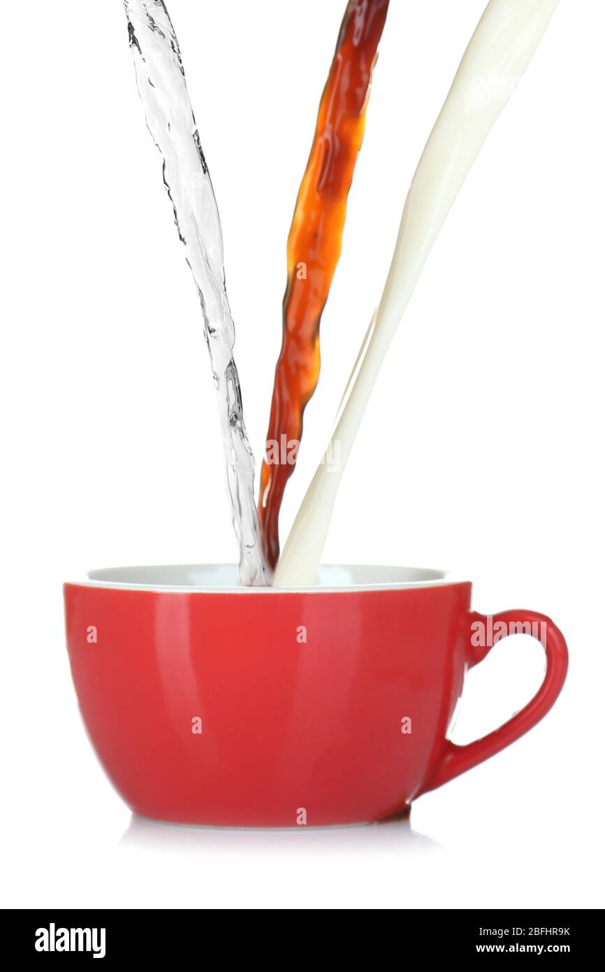 Pouring water, coffee and milk into cup isolated on white Stock Photo