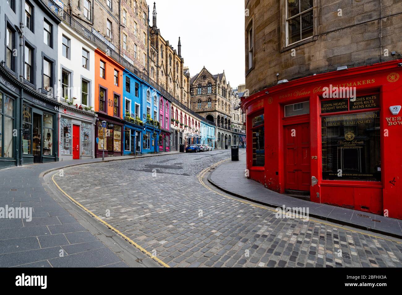 Edinburgh, Scotland, UK. 18 April 2020. Views of empty streets and members of the public outside on another Saturday during the coronavirus lockdown in Edinburgh. Shops and restaurants on Victoria Street are closed and street deserted. Iain Masterton/Alamy Live News Stock Photo