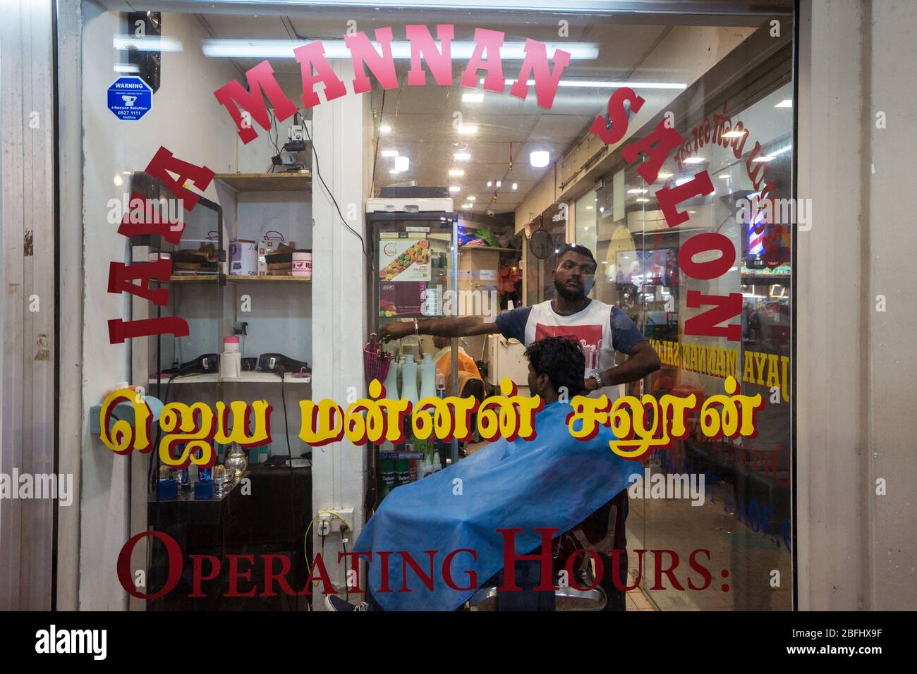 Singapore / Singapore - February 15, 2019: hairdresser and client in  interior of barber shop in Indian neighborhood of Singapore Stock Photo -  Alamy