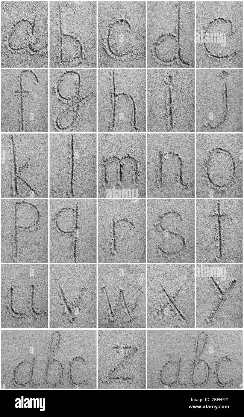 Handwritten alphabet letters on sand background Stock Photo Alamy
