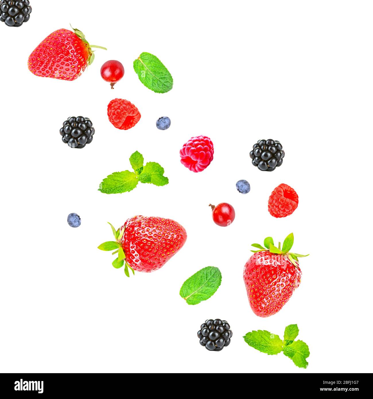 Falling berries isolated on white Stock Photo