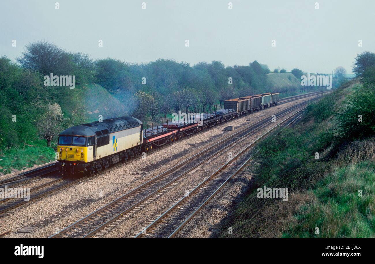 A class 56 diesel locomotive number 56046 working a freight train loaded with steel at South Moreton on the Great Western Mainline. Stock Photo