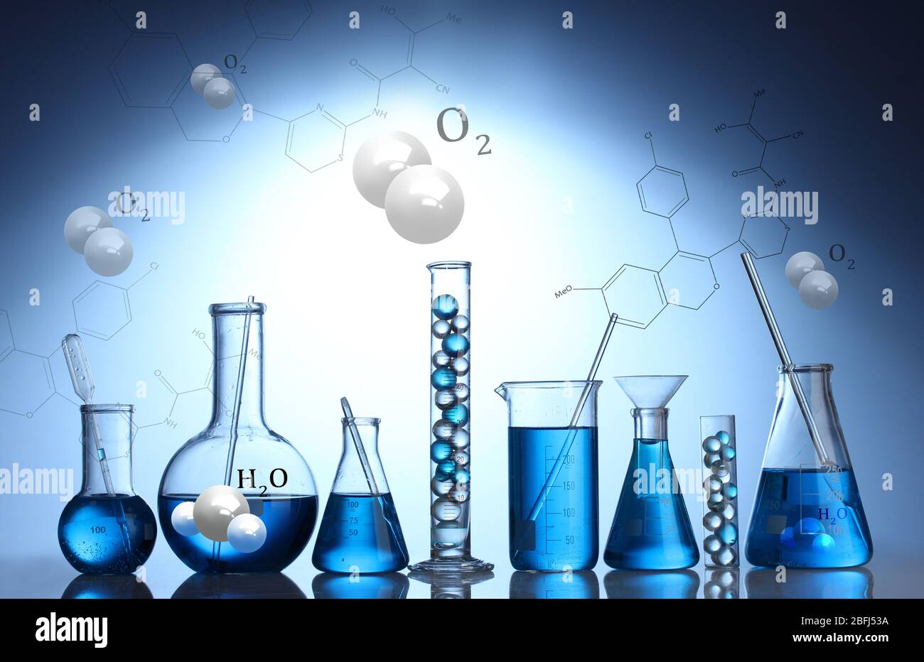 Test-tubes with blue liquid on blue background Stock Photo - Alamy