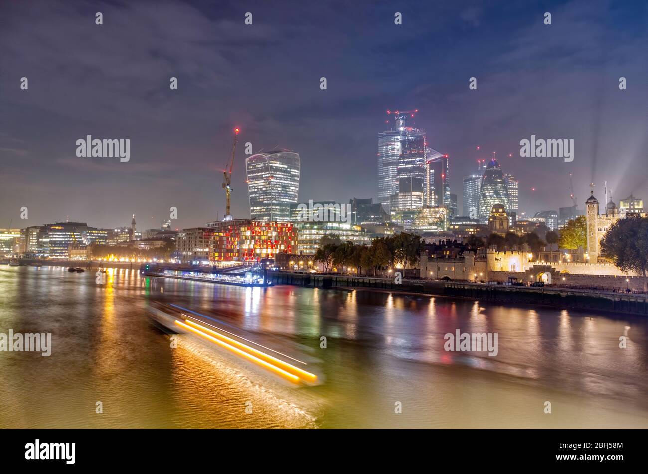 London cityscape from Tower Bridge after fireworks on Bonfire night Stock Photo