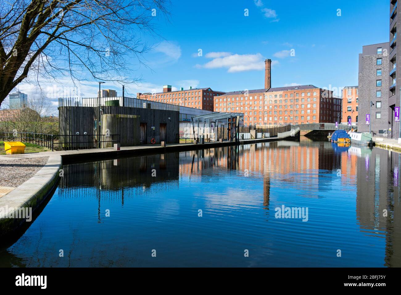 Murrays' Mills (now apartments) reflected in the Cotton Field Park marina, New Islington