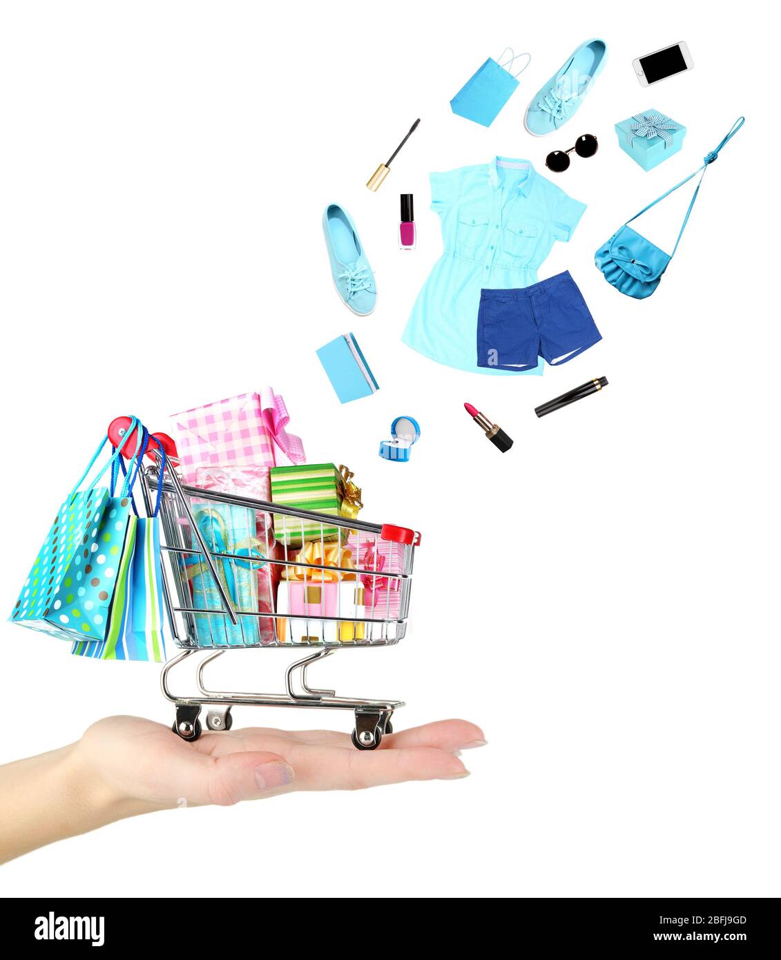Goods falling into cart isolated on white Stock Photo