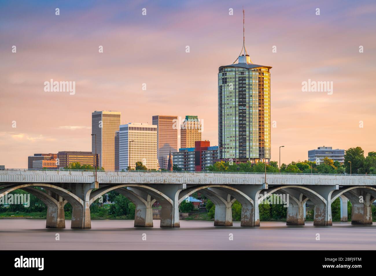 Tulsa, Oklahoma, USA downtown skyline on the Arkansas River at dusk